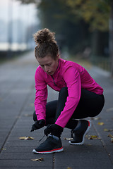 Image showing woman  stretching before morning jogging