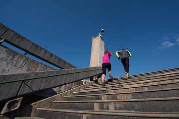 Image showing young  couple jogging on steps