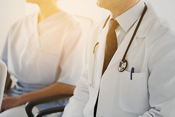 Image showing close up of happy doctors at seminar or hospital