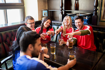 Image showing fans or friends watching football at sport bar