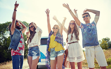 Image showing happy young hippie friends dancing outdoors