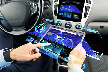 Image showing close up of man with tablet pc in car