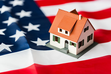 Image showing close up of house model on american flag