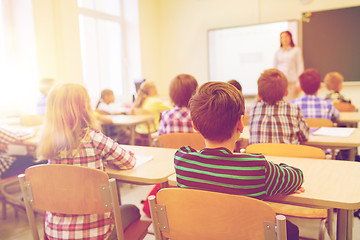 Image showing group of school kids and teacher in classroom