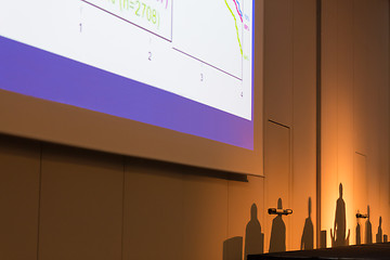 Image showing Silhouettes of leaders on a podium.