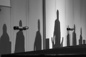 Image showing Silhouettes of leaders on a podium.