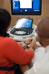 Image showing Medical doctor student learning to use ultra sound scanner machine.