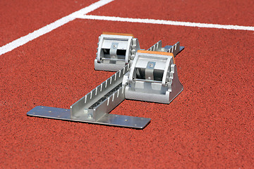 Image showing Athletics starting blocks on race track