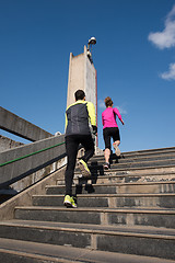 Image showing young  couple jogging on steps