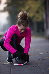 Image showing woman  stretching before morning jogging