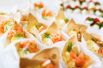 Image showing close up of dough cornet with salmon fish filling