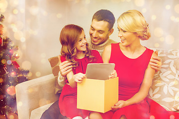 Image showing smiling family with tablet pc