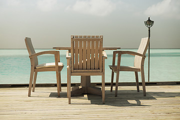 Image showing outdoor restaurant terrace with furniture over sea