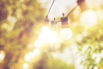 Image showing close up of light bulb garland hanging in garden