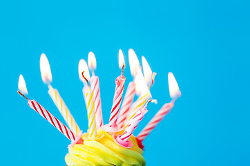 Image showing birthday cupcake with many burning candles