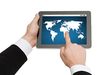 Image showing close up of hands holding tablet pc with world map