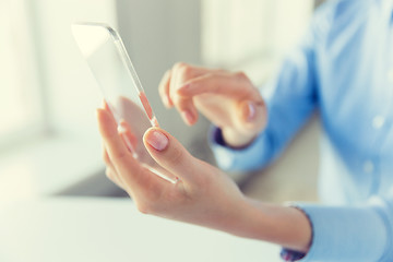 Image showing close up of woman with transparent smartphone