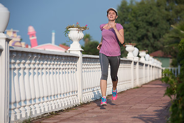 Image showing sporty woman jogging