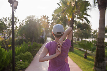 Image showing woman  stretching before morning jogging