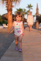 Image showing girl and mother walking