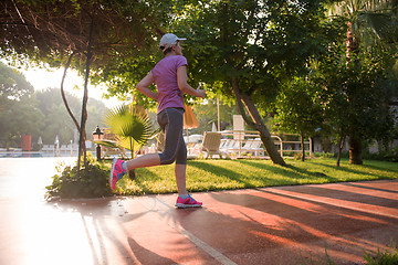 Image showing sporty woman jogging