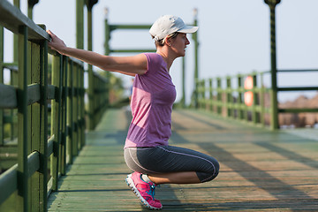 Image showing woman  stretching before morning jogging