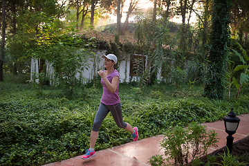 Image showing sporty woman jogging