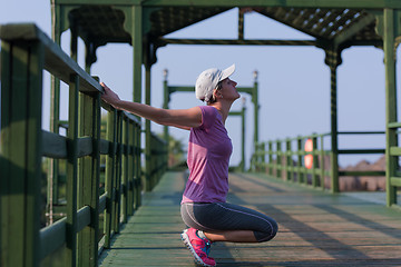 Image showing woman  stretching before morning jogging