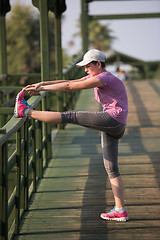 Image showing woman  stretching before morning jogging