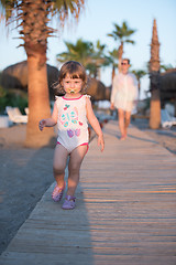 Image showing girl and mother walking