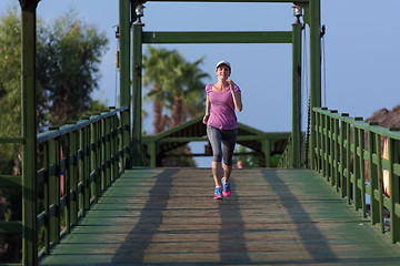 Image showing sporty woman jogging