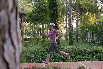 Image showing sporty woman jogging