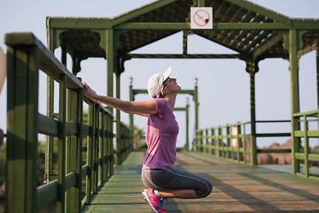 Image showing woman  stretching before morning jogging