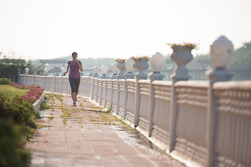 Image showing sporty woman jogging