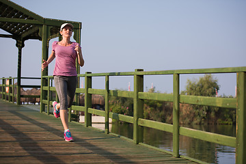 Image showing sporty woman jogging