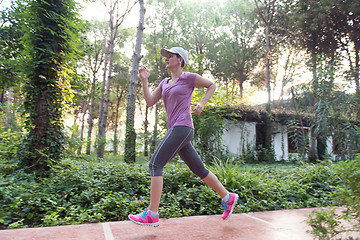 Image showing sporty woman jogging