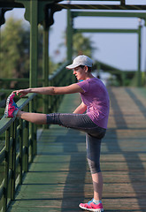 Image showing woman  stretching before morning jogging