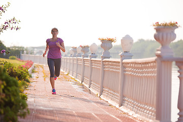 Image showing sporty woman jogging