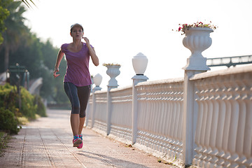 Image showing sporty woman jogging