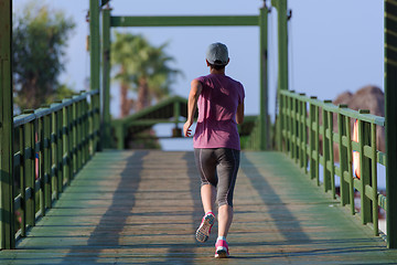 Image showing sporty woman jogging