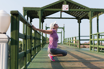 Image showing woman  stretching before morning jogging