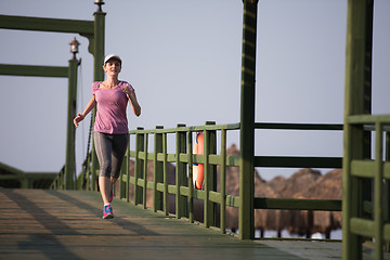 Image showing sporty woman jogging