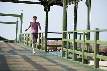 Image showing sporty woman jogging