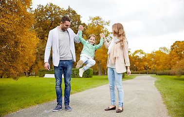 Image showing happy family walking in summer park and having fun