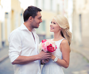 Image showing couple with flowers in the city