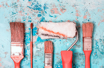 Image showing Set Of Paint Brushes On A Blue Wooden Background