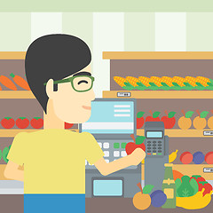 Image showing Cashier standing at the checkout in supermarket.