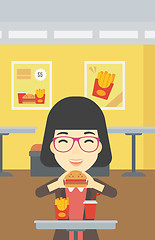 Image showing Woman eating hamburger vector illustration.