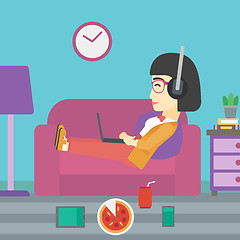 Image showing Woman lying on sofa with many gadgets.