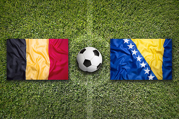 Image showing Belgium and Bosnia and Herzegovina flags on soccer field